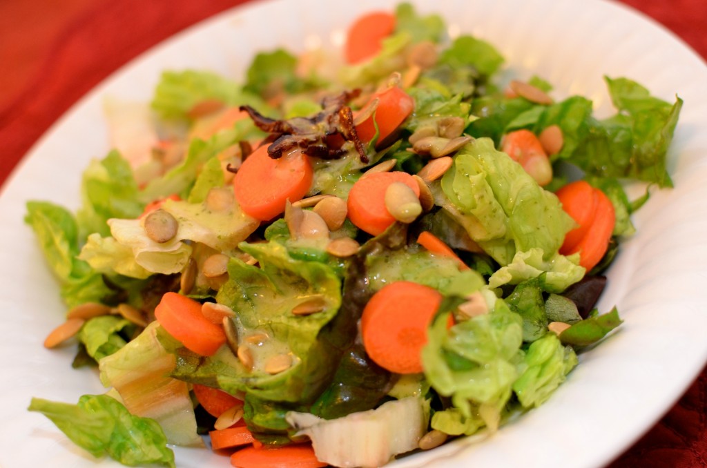 Romaine salad with carrots and toasted pumpkin seeds